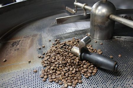 coffee beans in the cooling tray of a coffee roaster