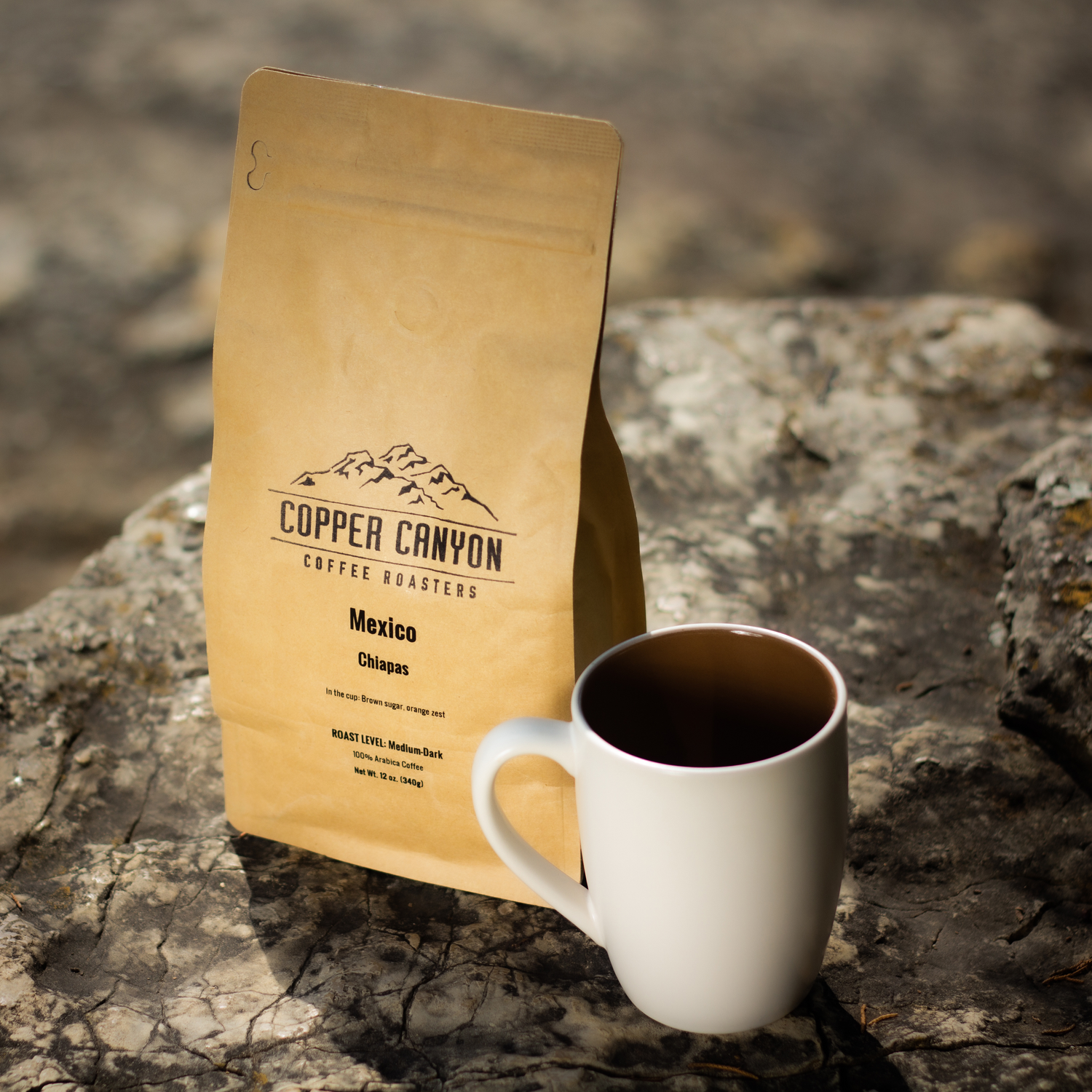 ceramic coffee mug next to Copper Canyon's Mexico coffee