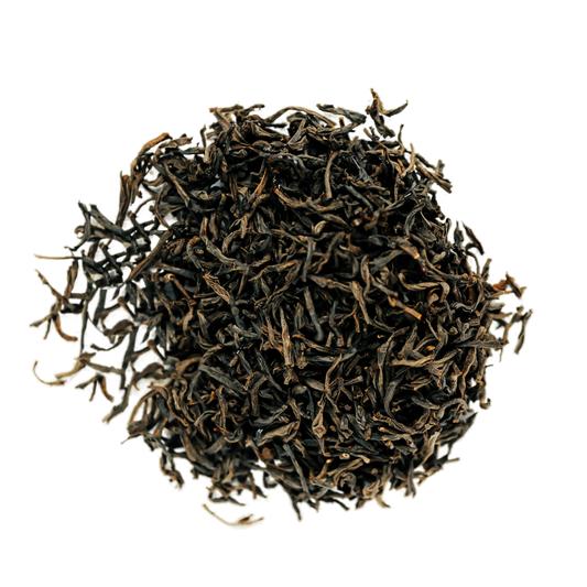 English Breakfast Black Tea Loose Leaf Tea leaves sit on a white surface
