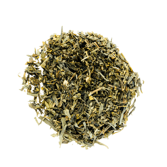 Maple Walnut Truffle Green Tea Loose Leaf Tea leaves sit on a white surface