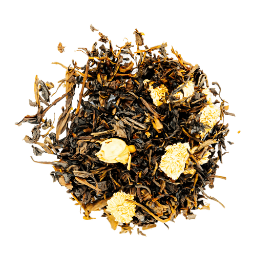 Mango Lotus Garden Oolong Tea Loose Leaf Tea leaves sit on a white surface