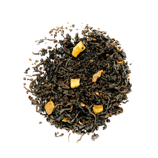 Spiced Orange Black Tea Loose Leaf Tea leaves sit on a white surface